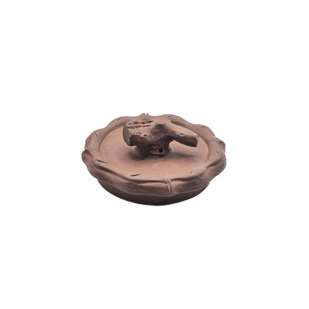 Close-up view of a vintage Factory 1 Yixing Zisha clay teapot lid featuring a wavy segmented rim and a hand-sculpted gnarled pine branch finial with an air vent hole.