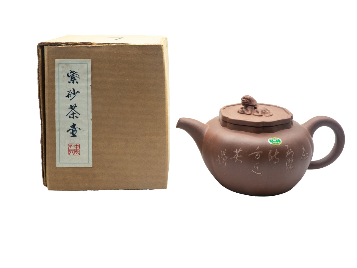 Vintage Factory 1 Yixing Zisha clay teapot shown side-by-side with its original rare brown cardboard shipping box featuring a vertical white calligraphy label and a red seal stamp.