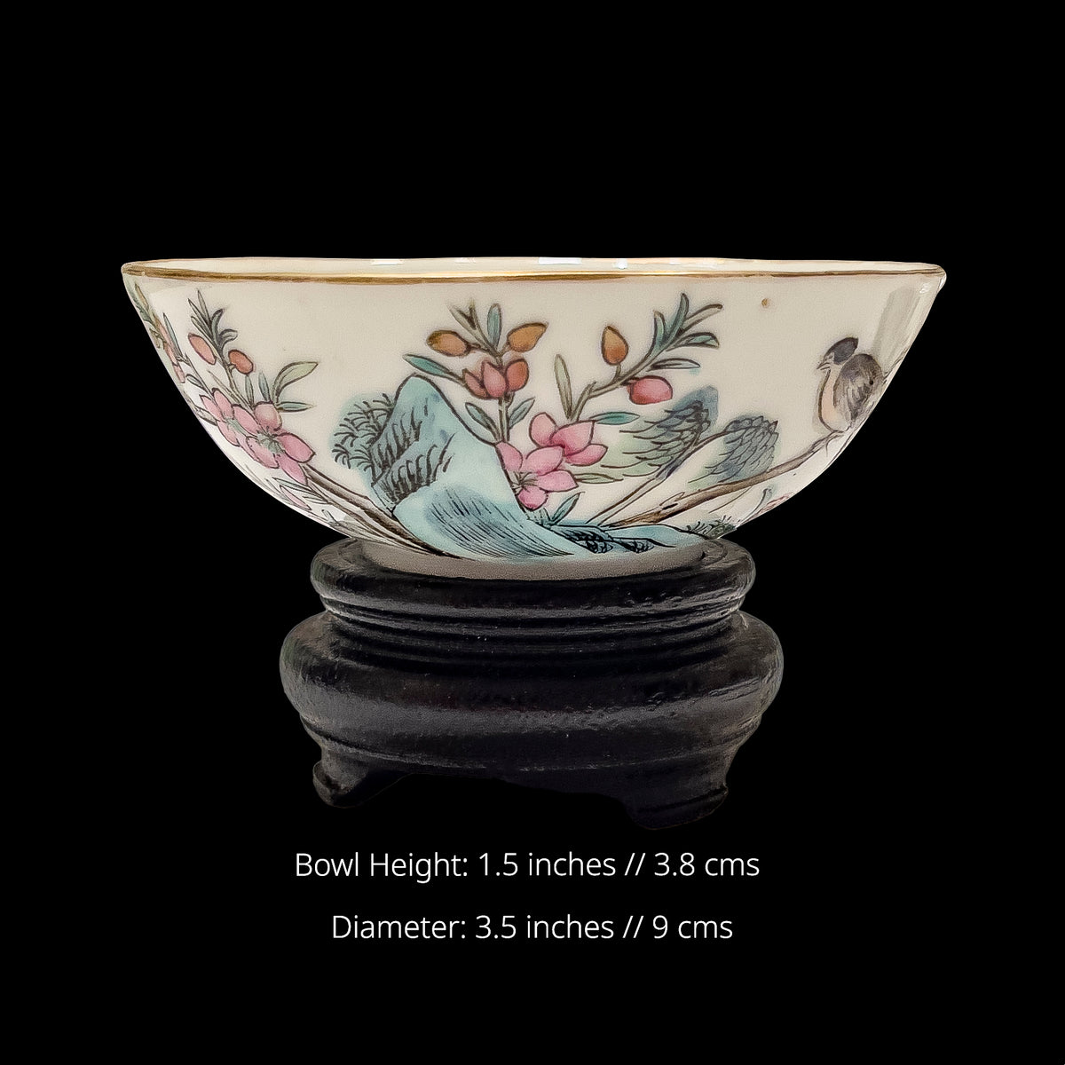 Measurement infographic for an antique Chinese porcelain wine cup showing dimensions of 3.5 inches wide by 1.5 inches tall on a wooden stand decorated with painted bird and blossoms.