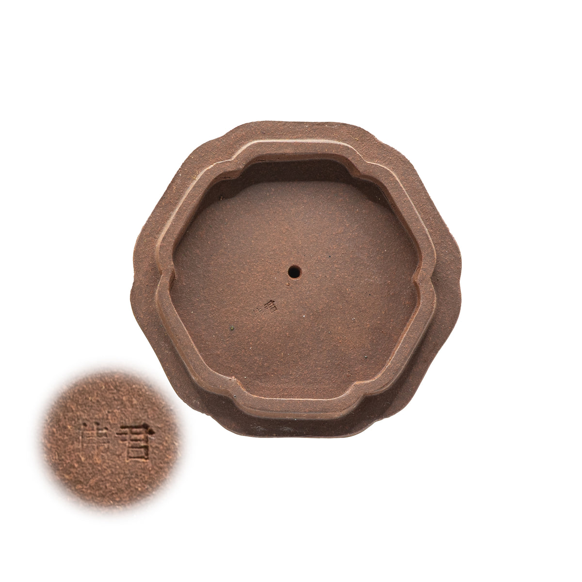 Macro view of the underside of a vintage Factory 1 Yixing teapot lid showing the authentic hand-stamped Chinese artisan seal characters for Wei Jun.