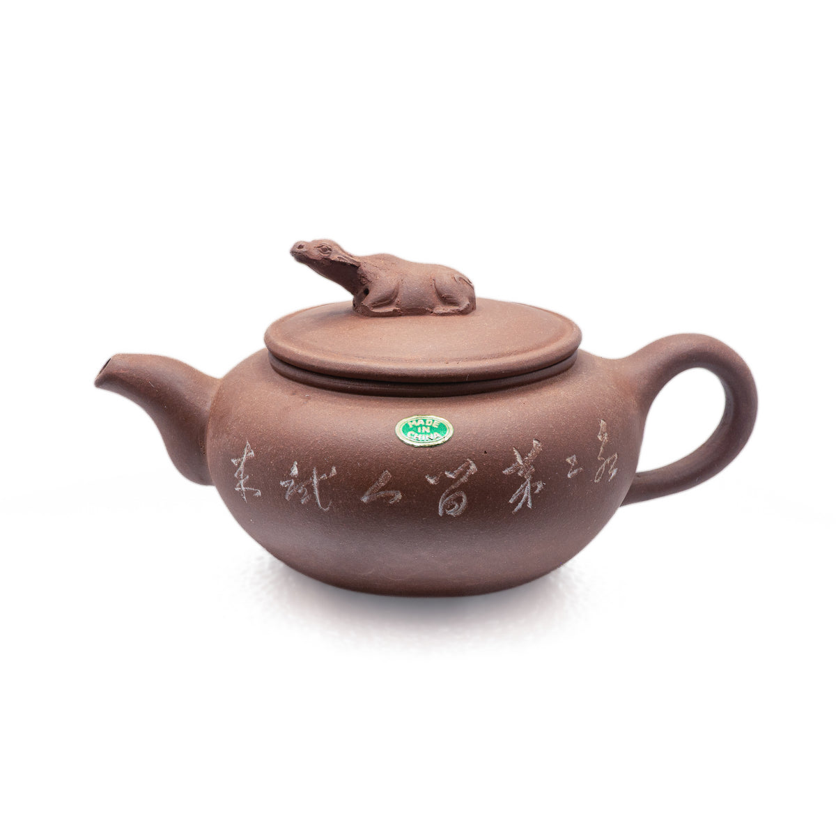 Authentic vintage Factory 1 Yixing Zisha red clay teapot featuring a sculpted water buffalo lid finial, incised calligraphic inscriptions, and an original oval green foil label