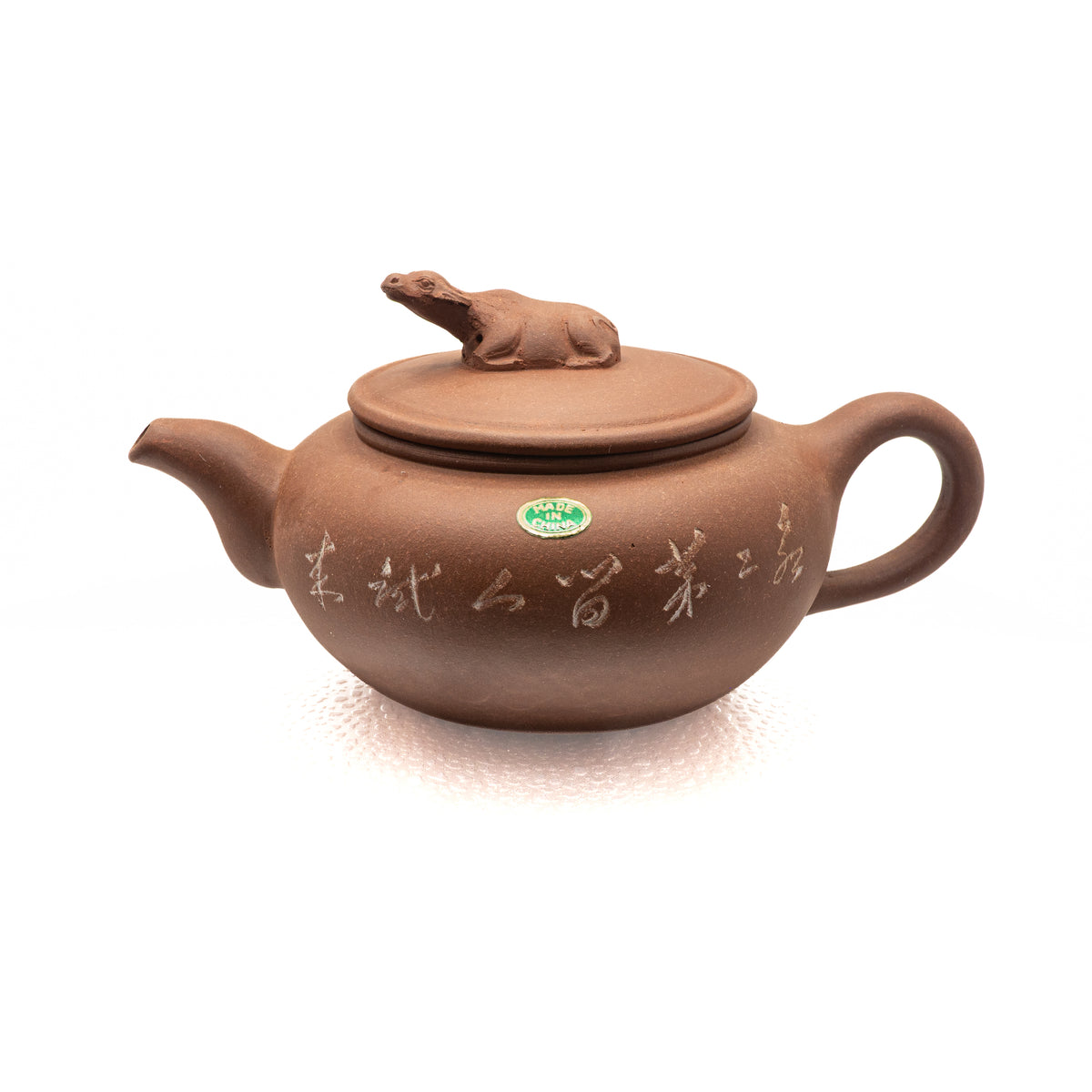 Authentic vintage Factory 1 Yixing Zisha red clay teapot featuring a sculpted water buffalo lid finial, incised calligraphic inscriptions, and an original oval green foil label
