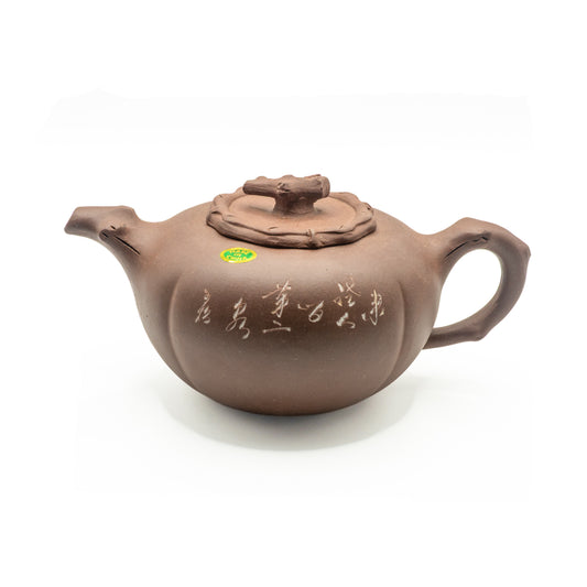 Authentic vintage Factory 1 Yixing Zisha clay gourd shape teapot featuring a hand-sculpted resting lion lid finial, incised calligraphic inscriptions, and an original oval green foil label over a white studio background.