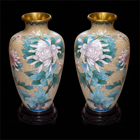 Pair of vintage Chinese cloisonne enamel vases with white chrysanthemums on a cream cloud ground with wooden stands.